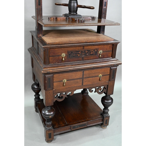 946 - An antique oak, walnut and marquetry book press, with two frieze drawers, raised on four bulbous sup... 