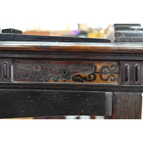 946 - An antique oak, walnut and marquetry book press, with two frieze drawers, raised on four bulbous sup... 