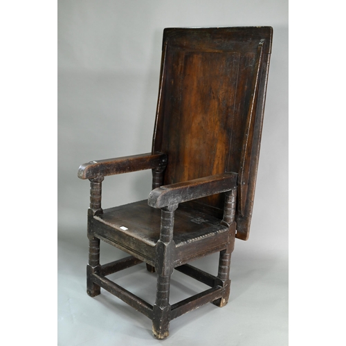 947 - A Charles I jointed oak box-seat table-chair, circa 1640, having a pivotal boarded top/back with cle... 