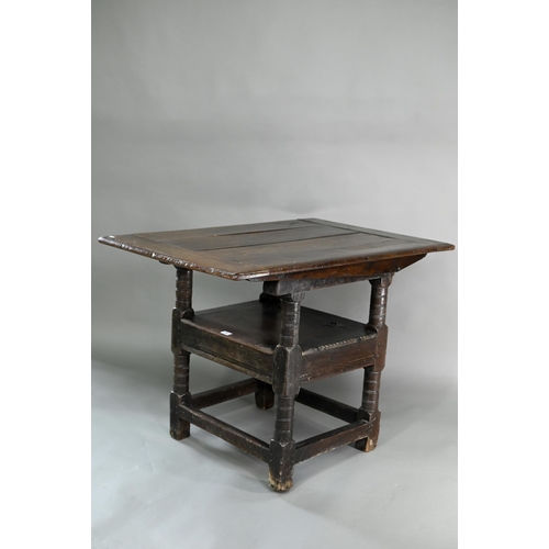 947 - A Charles I jointed oak box-seat table-chair, circa 1640, having a pivotal boarded top/back with cle... 