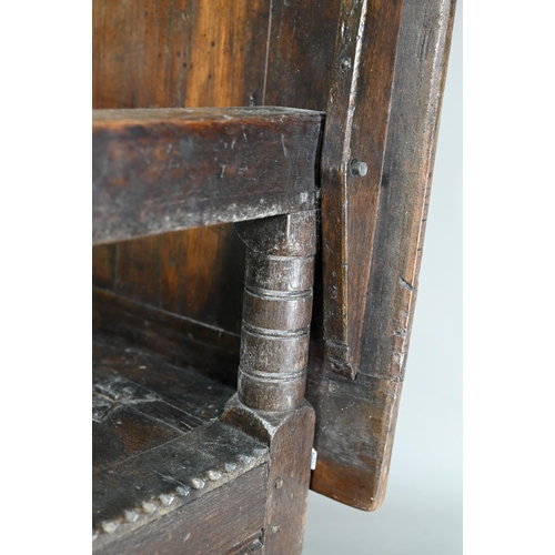 947 - A Charles I jointed oak box-seat table-chair, circa 1640, having a pivotal boarded top/back with cle... 