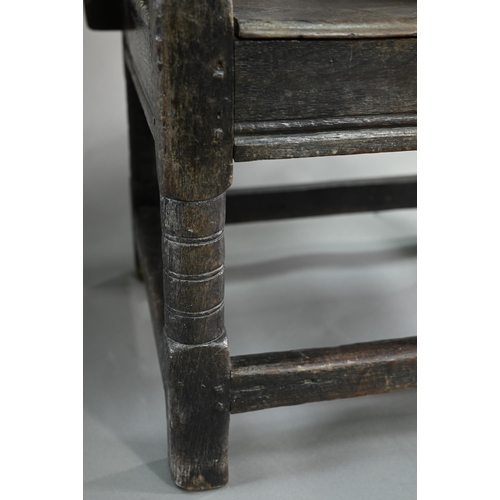 947 - A Charles I jointed oak box-seat table-chair, circa 1640, having a pivotal boarded top/back with cle... 