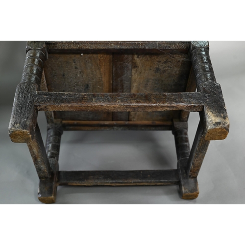 947 - A Charles I jointed oak box-seat table-chair, circa 1640, having a pivotal boarded top/back with cle... 