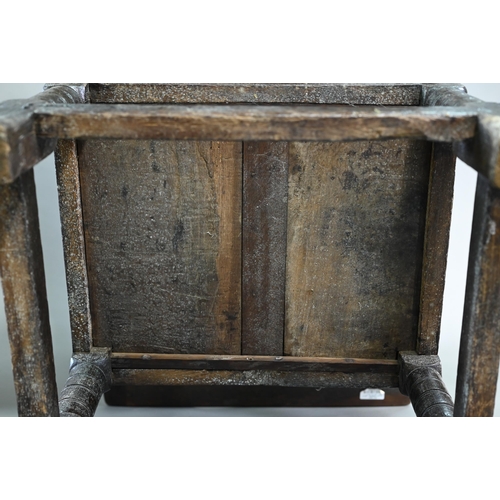 947 - A Charles I jointed oak box-seat table-chair, circa 1640, having a pivotal boarded top/back with cle... 