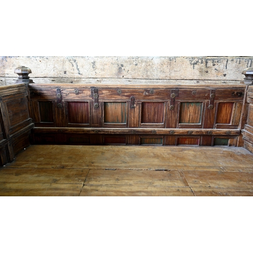 948 - An old Indian iron bound teak box seat settle/bench, the patinated surface finish including traces o... 