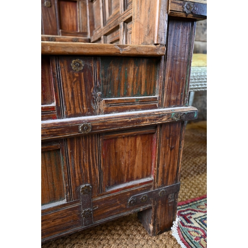 948 - An old Indian iron bound teak box seat settle/bench, the patinated surface finish including traces o... 