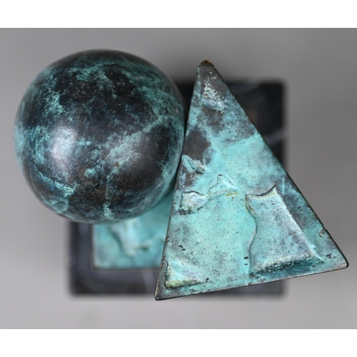 954 - A green-patinated bronze abstract sculpture of geometric shapes (cube, sphere and pyramid), 9.5 cm h... 