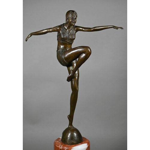 957 - A brown-patinated bronzed figure of an Art Deco dancing girl, after J Philipp, on marble plinth, imp... 