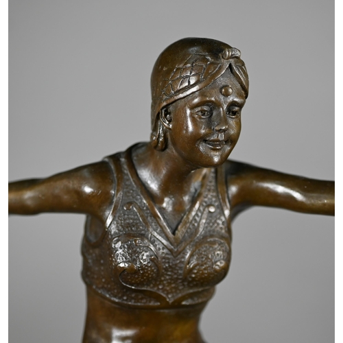 957 - A brown-patinated bronzed figure of an Art Deco dancing girl, after J Philipp, on marble plinth, imp... 