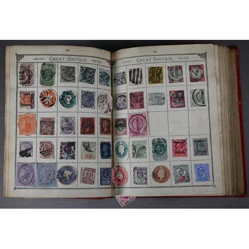 984 - An album of Victorian and later British Empire and foreign postage stamps, to/w an album of crests, ... 