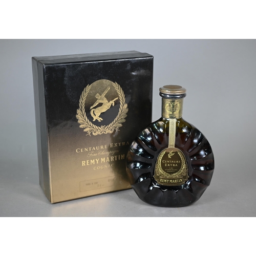 A boxed bottle of Remy Martin Centaure Extra Fine Champagne Cognac