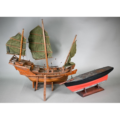 1158 - An antique wooden two-masted pond yacht hull with lead keel, 59 cm long to/w a wooden model of a Chi... 