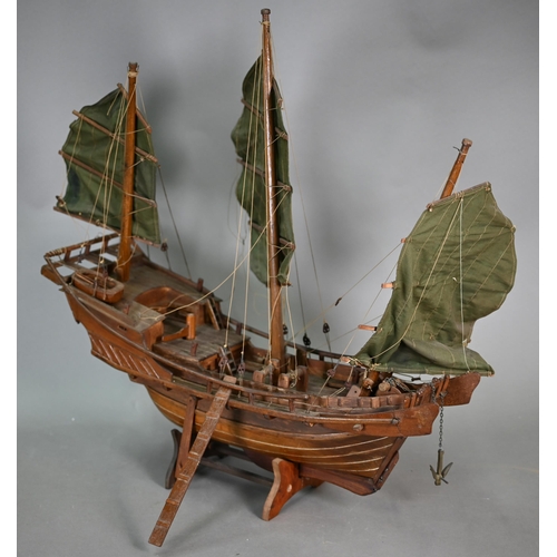 1158 - An antique wooden two-masted pond yacht hull with lead keel, 59 cm long to/w a wooden model of a Chi... 