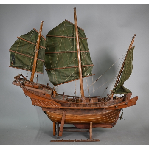 1158 - An antique wooden two-masted pond yacht hull with lead keel, 59 cm long to/w a wooden model of a Chi... 