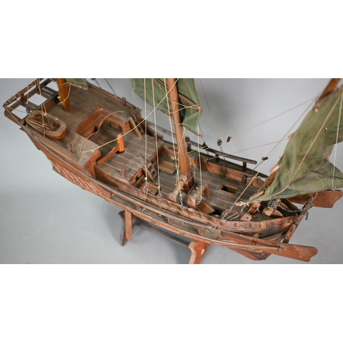 1158 - An antique wooden two-masted pond yacht hull with lead keel, 59 cm long to/w a wooden model of a Chi... 