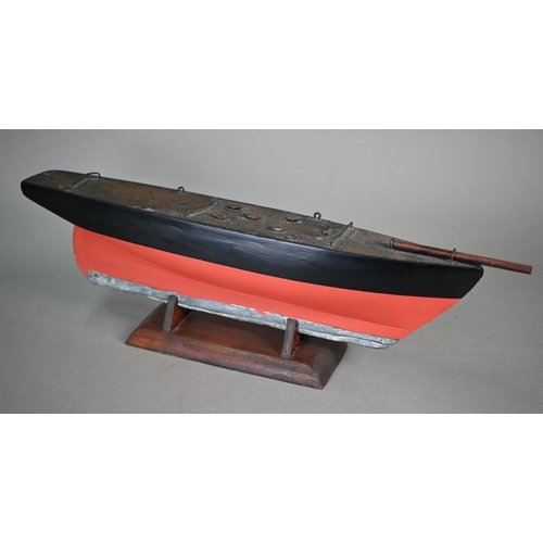 1158 - An antique wooden two-masted pond yacht hull with lead keel, 59 cm long to/w a wooden model of a Chi... 