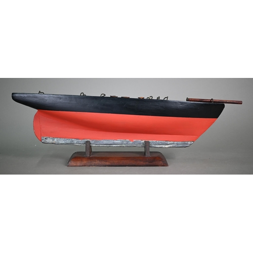 1158 - An antique wooden two-masted pond yacht hull with lead keel, 59 cm long to/w a wooden model of a Chi... 