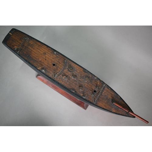 1158 - An antique wooden two-masted pond yacht hull with lead keel, 59 cm long to/w a wooden model of a Chi... 