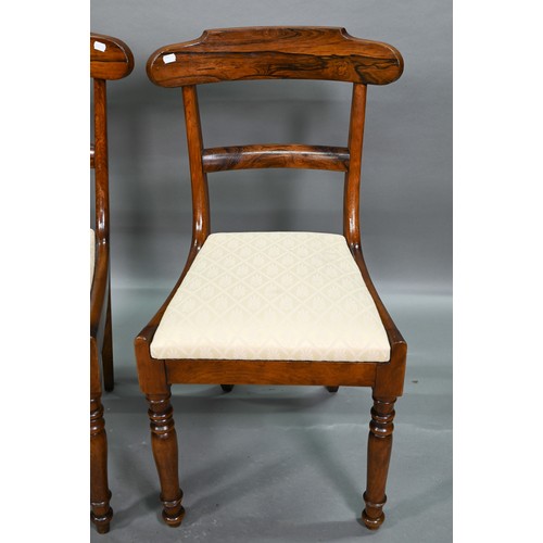 848 - A set of six Victorian hardwood dining side chairs with shaped bar backs over fabric seat pads, rais... 