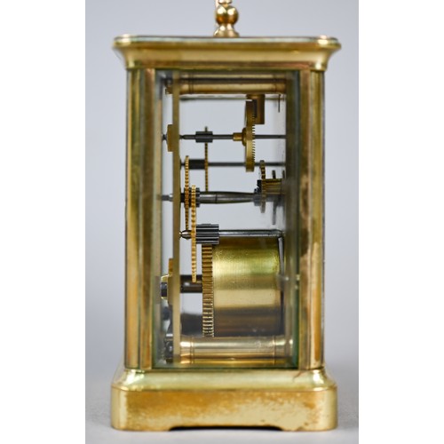 777 - A small French brass single drum 8-day carriage clock, with white enamelled dial with Roman numerals... 