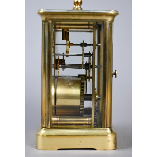 777 - A small French brass single drum 8-day carriage clock, with white enamelled dial with Roman numerals... 