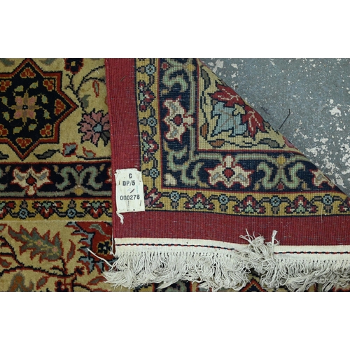 835 - An old Persian Indo Persian Saruk carpet, the deep pink ground centred by a floral medallion, 390 cm... 