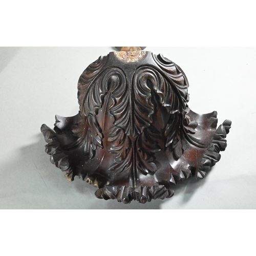 847 - A trio of carved hardwood wall brackets, one large 27 cm high, two 24 cm high, all a/f (3)