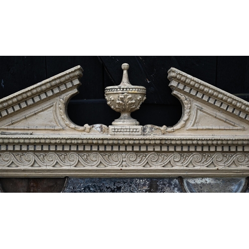 900 - A Georgian Adam style over mantel mirror, the broken arched pediment centred by an urn over Arabic a... 