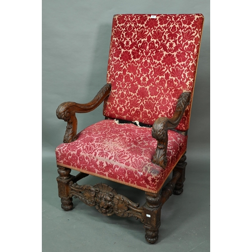 951 - A Victorian carved and moulded oak framed throne chair, with remnants of plush fabric back and seat ... 