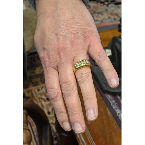 251 - A 22ct yellow gold gypsy ring set with two diamonds and central yellow stone, possibly sapphire, dia... 