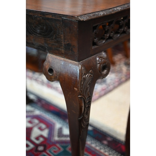 885 - A Regency mahogany small serving table of Irish Chippendale style, the rectangular top with moulded ... 