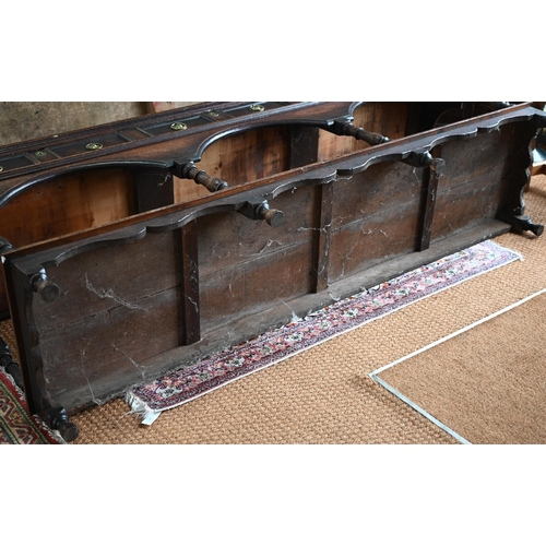 925 - An antique oak low dresser with three double moulded front drawers over a triple arched apron, raise... 