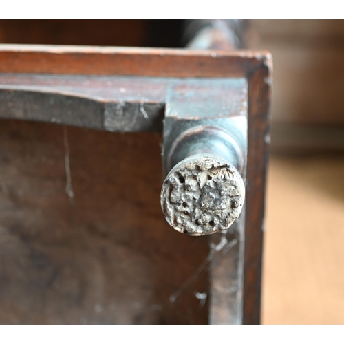 925 - An antique oak low dresser with three double moulded front drawers over a triple arched apron, raise... 