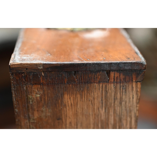 884 - An 18th century mahogany chest with a full width slide over four long graduated drawers, each with (... 