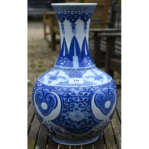 334 - A late 19th century Chinese blue and white vase, the flared neck painted with diaper, ruyi-head and ... 