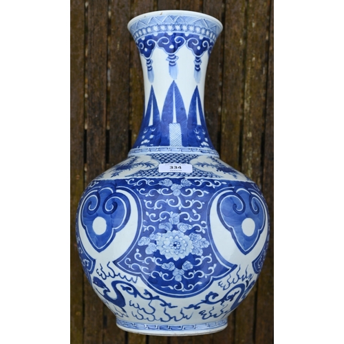 334 - A late 19th century Chinese blue and white vase, the flared neck painted with diaper, ruyi-head and ... 