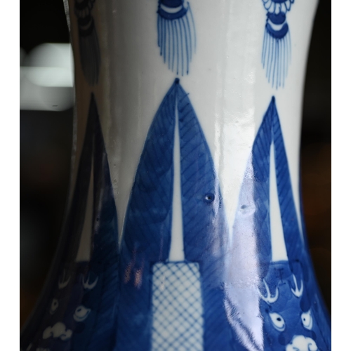 334 - A late 19th century Chinese blue and white vase, the flared neck painted with diaper, ruyi-head and ... 