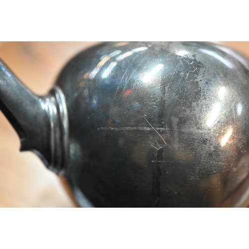 80 - A heavy quality silver bullet-shaped tea pot on the 18th Century manner, with wooden finial and scro... 