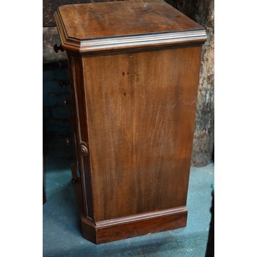 910 - A pair of Victorian mahogany four drawer pedestals, with twin turned knobs and canted corners, 46 cm... 