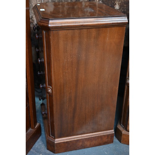 910 - A pair of Victorian mahogany four drawer pedestals, with twin turned knobs and canted corners, 46 cm... 