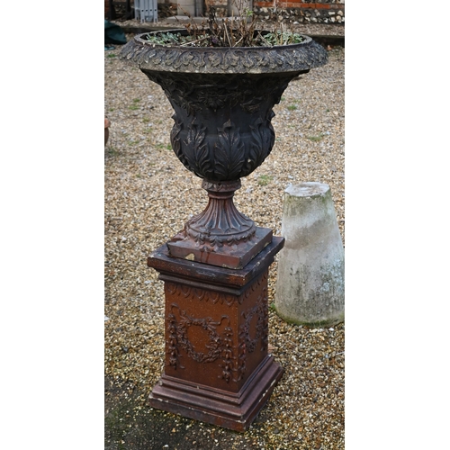A large weathered classical cast urn on plinth, with patinated teracotta surface finish, on square plinth base, 137 cm h o/all