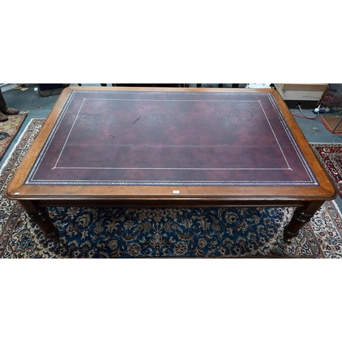 111 - A 19th century mahogany library table, the silver tooled burgundy leather inset top over a pair of f... 