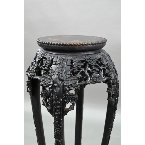 396 - A 19th century Chinese circular jardiniere stand intricately carved and pierced with prunus designs ... 