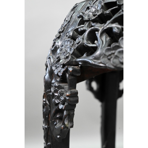 396 - A 19th century Chinese circular jardiniere stand intricately carved and pierced with prunus designs ... 