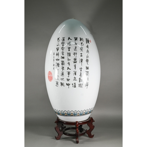 397 - A large 20th century Chinese porcelain egg painted in polychrome enamels with a winter landscape and... 