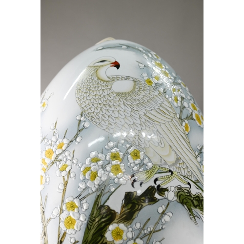 397 - A large 20th century Chinese porcelain egg painted in polychrome enamels with a winter landscape and... 