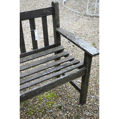 100 - A weathered teak garden bench