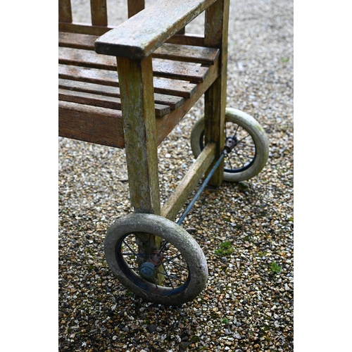 102 - A weathered teak garden bench