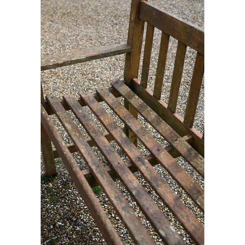 102 - A weathered teak garden bench