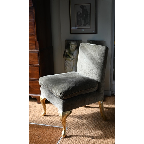 105 - George Smith Ltd, a green fabric upholstered chair with seat cushion, raised on giltwood cabriole fr... 